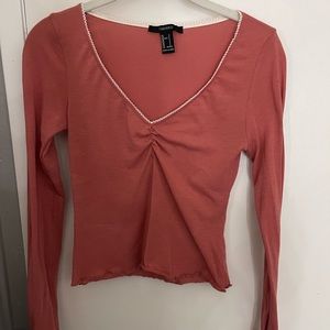 blush colored long sleeve crop top